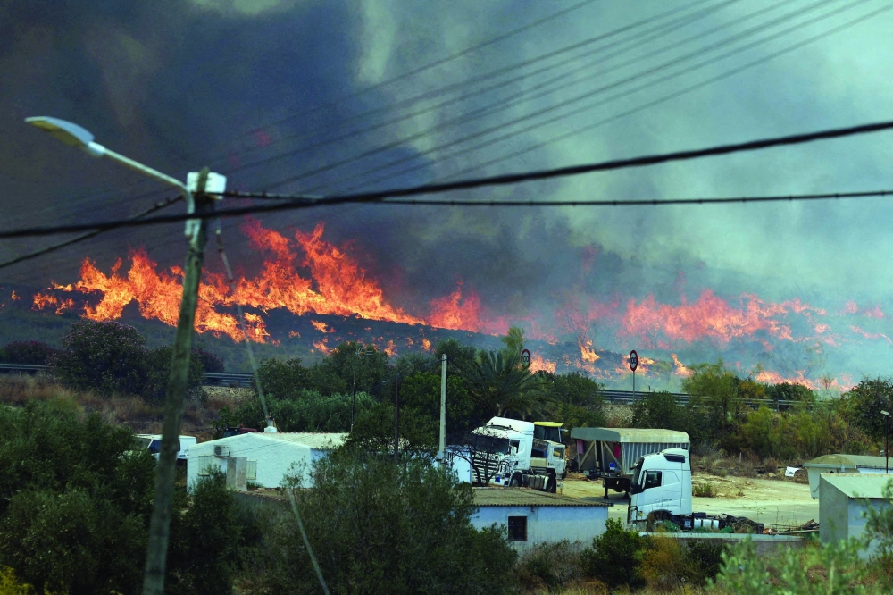 Smoke and flame rise amidst deadly wildfires affecting Almeria province, in Los Gallardos, Almeria, Spain. — Reuters