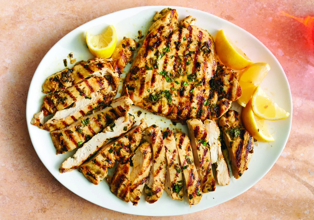 This smoky beauty of a recipe — with its juicy swirl of lemon and olive oil, its fragrant charred garlic and parsley — is mouthwatering in the primal way of fried drumsticks and saucy wings.