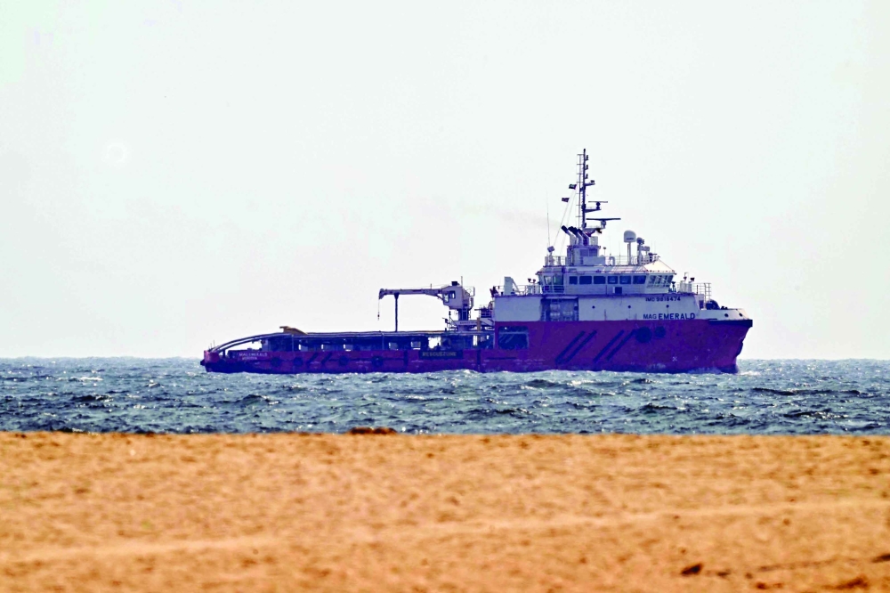 A ship sails off the coast of Ajman on Friday. — AFP