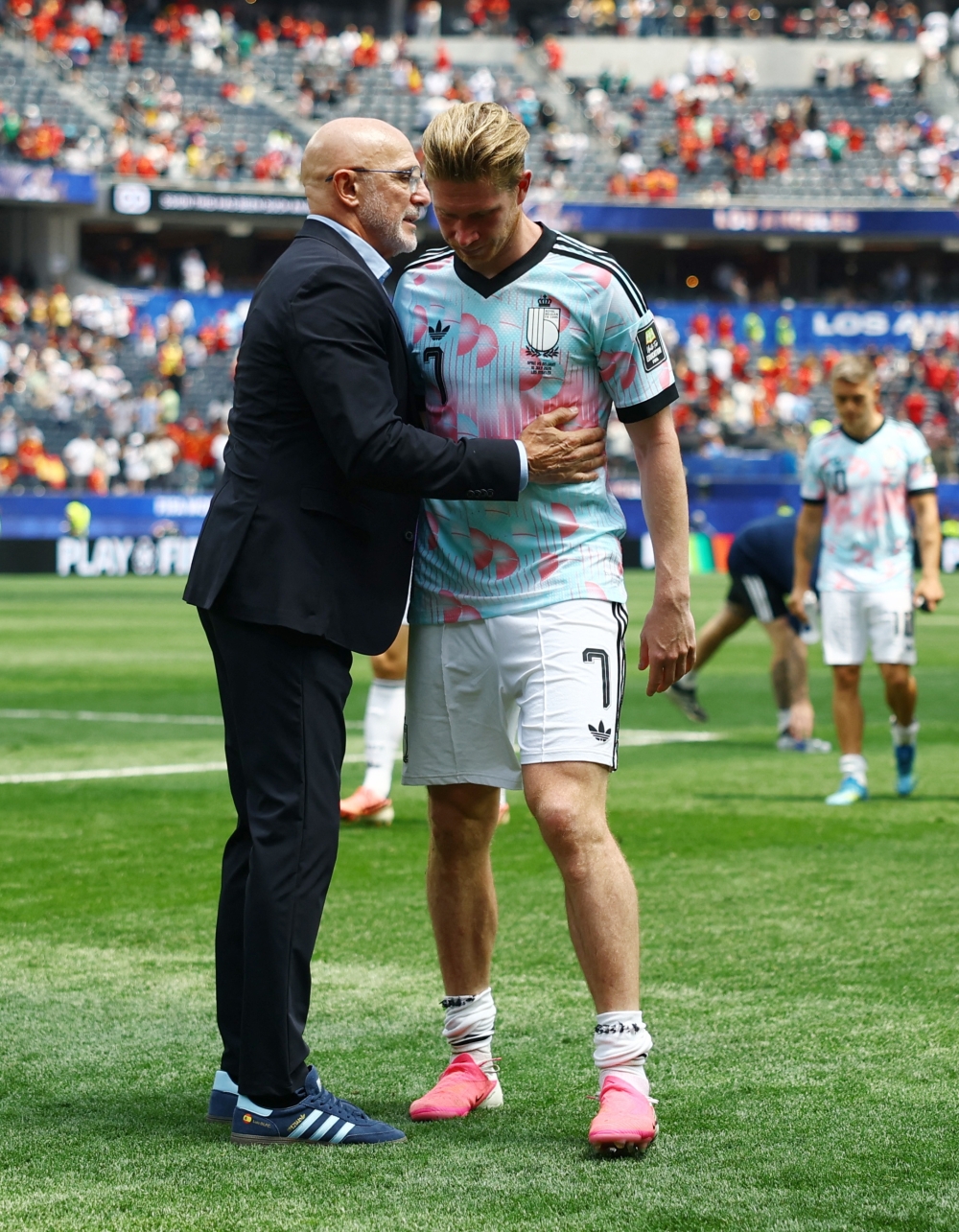 
Belgium's Kevin De Bruyne looks dejected with Spain coach Luis De La Fuente after the match  
