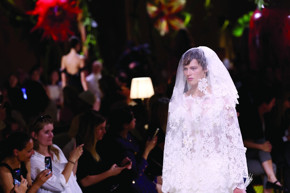 A model presents a creation by designer Matthieu Blazy as part of his Haute Couture Fall/Winter 2026-2027 collection show for the fashion house Chanel. -Reuters 