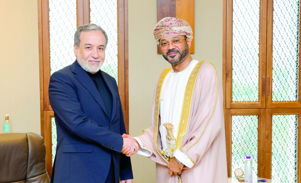 Sayyid Badr bin Hamad al Busaidi and Abbas Araqchi in Muscat on Saturday. — ONA
