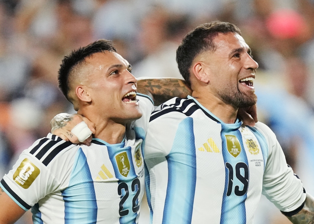  
Argentina's Lautaro Martinez and Nicolas Otamendi celebrate after the match 