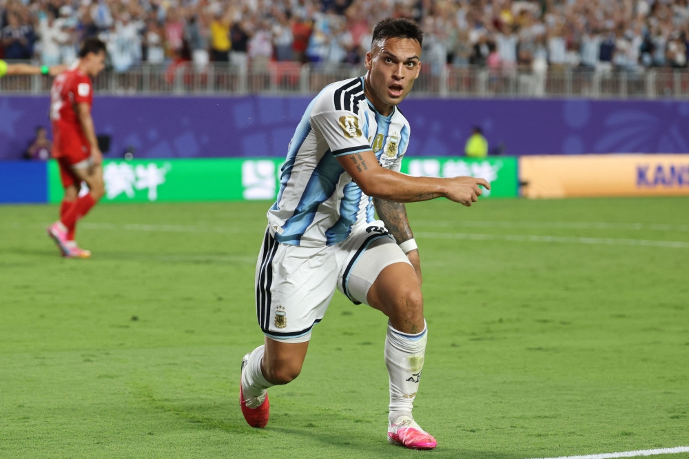 Argentina's forward #22 Lautaro Martinez celebrates scoring his team's third goal  