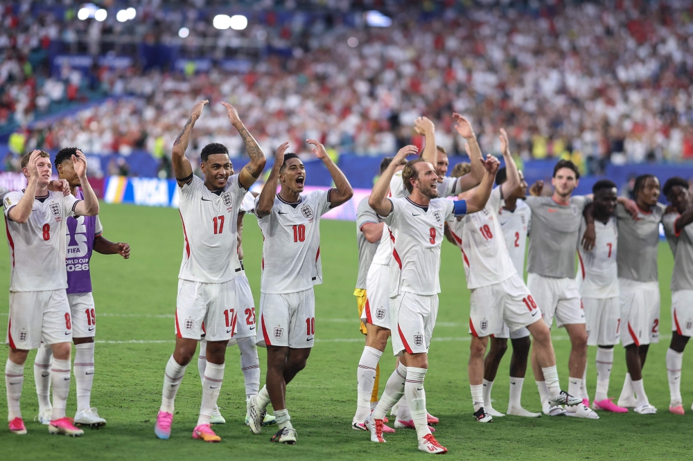 England players celebrate after the winning. — AFP