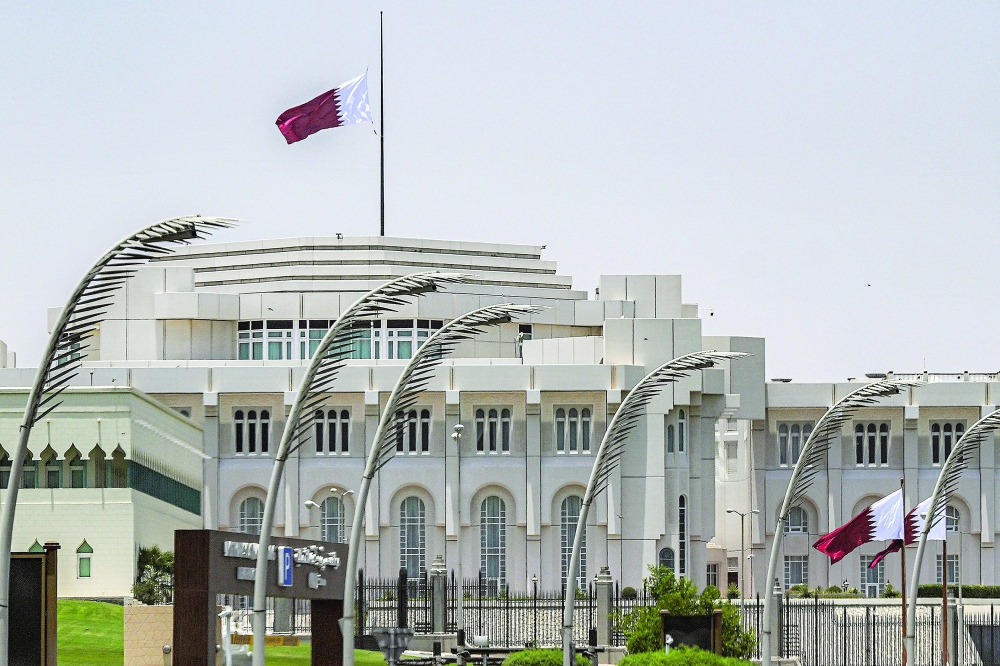 Qatar's flag flies at half-mast above the Amiri Diwan headquarters in Doha. — AFP