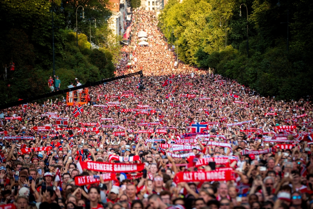 The men's national football team is greeted by the audience. — Reuters