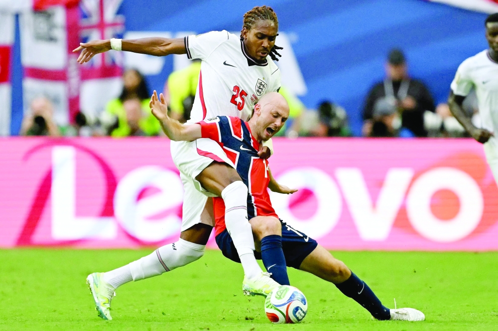 England's #25 Spence and Norway's #14 Aursnes. — AFP