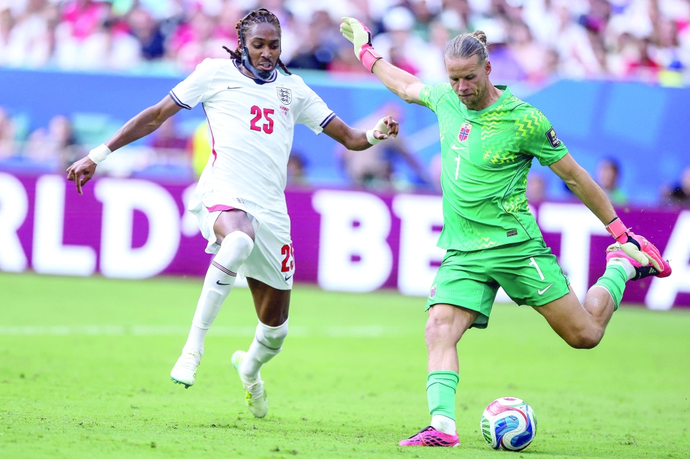 England's #25 Spence and Norway's goalkeeper. — AFP