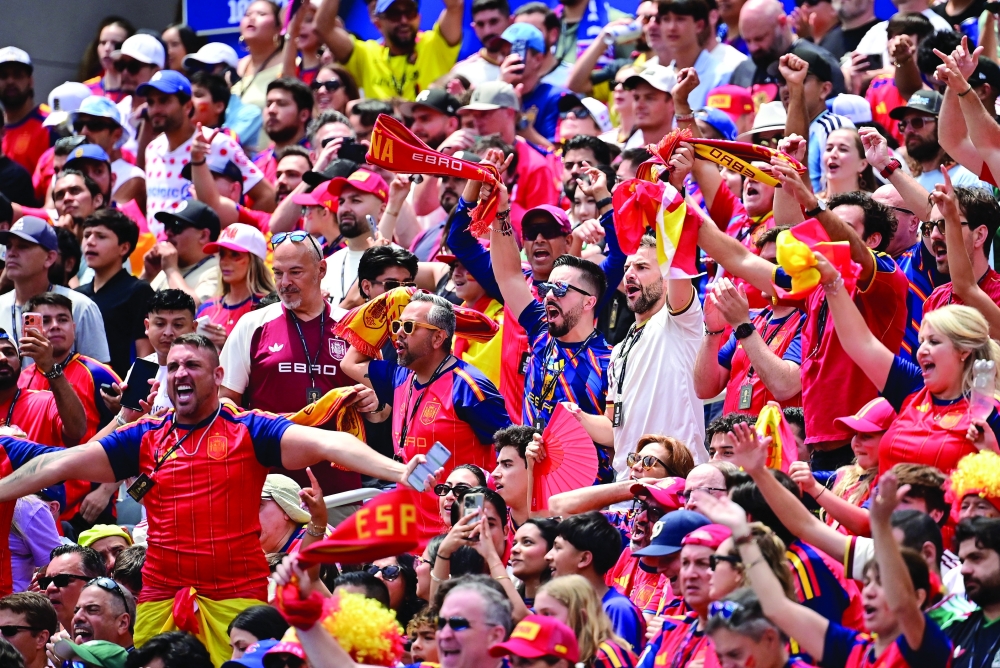  
Spain fans ahead of the match. — Reuters