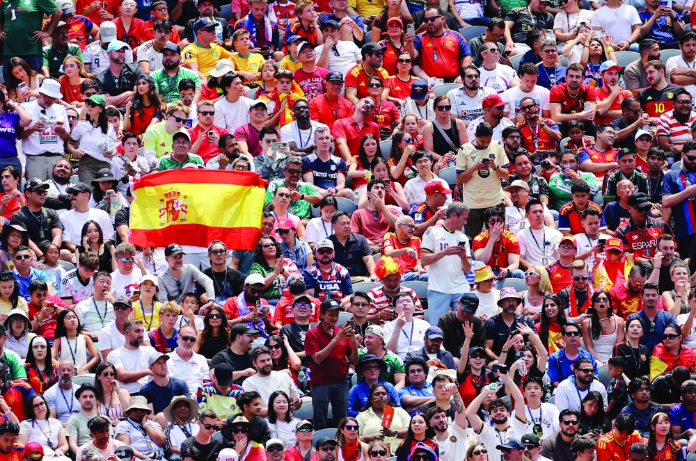  
Spain fans in the stand during the match. — Reuters  