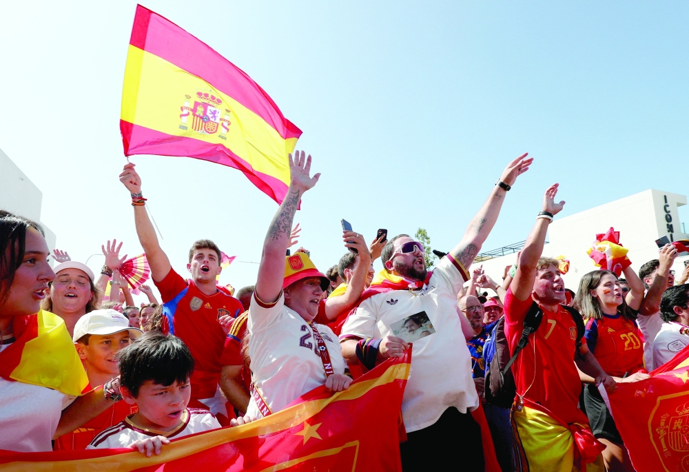  
Spain fans outside the stadium before the match. — Reuters    