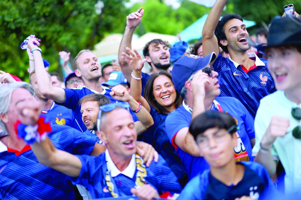 France fans gather ahead of their semi final match. — Reuters