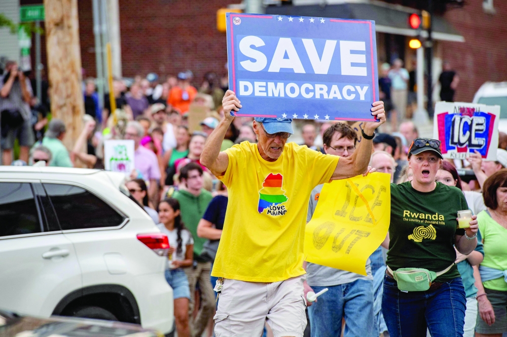 People participate in a peaceful walking vigil honoring a 26-year-old Colombian man who was fatally shot during an Immigration and Customs Enforcement (ICE) operation in Biddeford, Maine, on July 13, 2026. A US immigration officer on July 13, fatally shot a man identified by rights groups as a 26-year-old Colombian, an incident likely to fuel criticism of President Donald Trump's deportation drive. The shooting happened in Biddeford, a town of 22,000 people in the northern state of Maine, and comes a week after an Immigration and Customs Enforcement (ICE) agent shot dead a Mexican man in Texas.