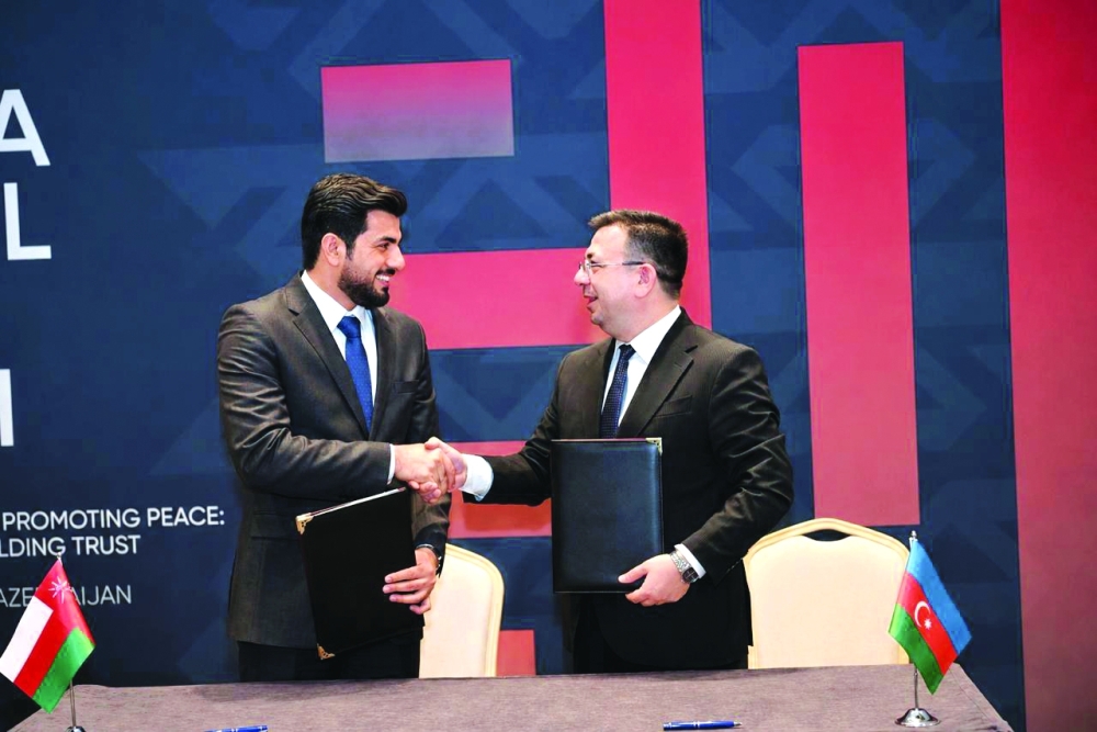 Ibrahim bin Salim al Salmi from ONA and Vugar Aliyev, AZERTAC, signed the agreement