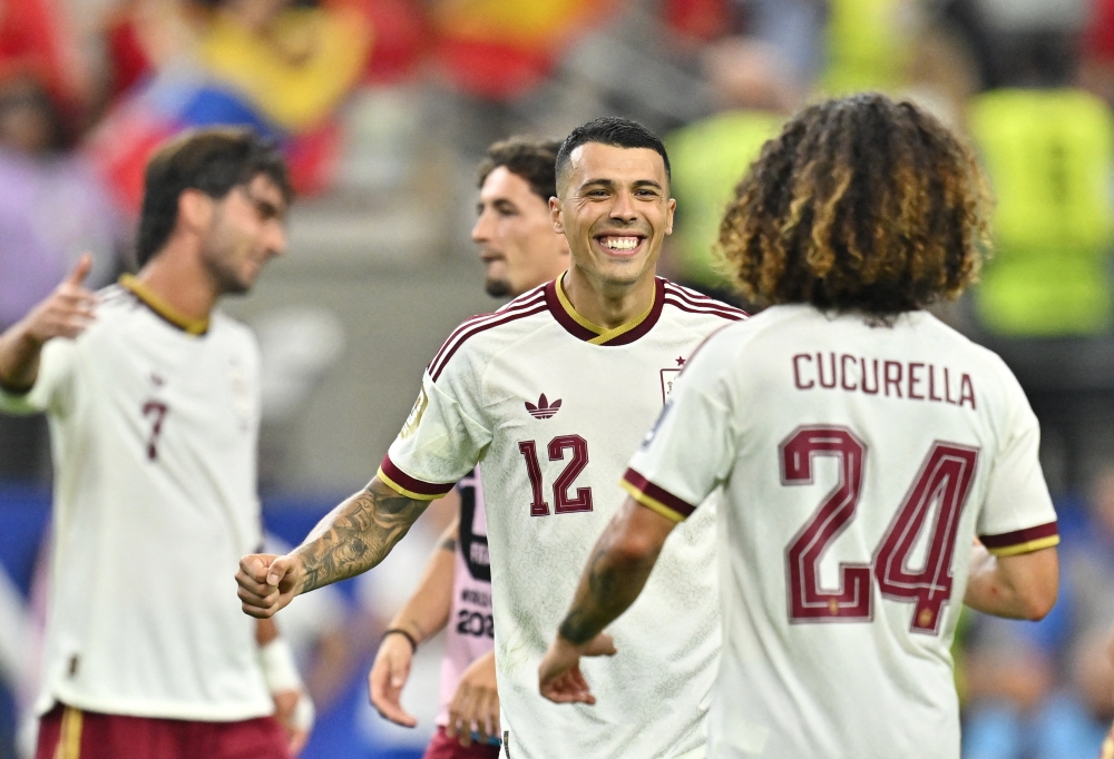  
Spain's Pedro Porro and Marc Cucurella celebrate after the match  