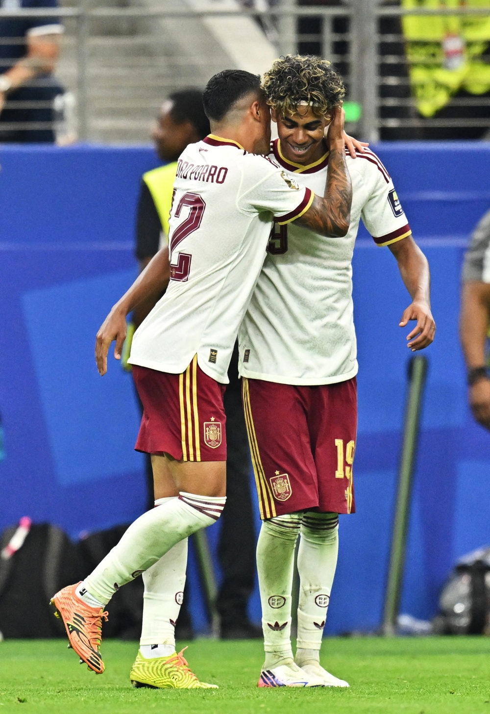  
Spain's Pedro Porro celebrates scoring their second goal with teammate Lamine Yamal 