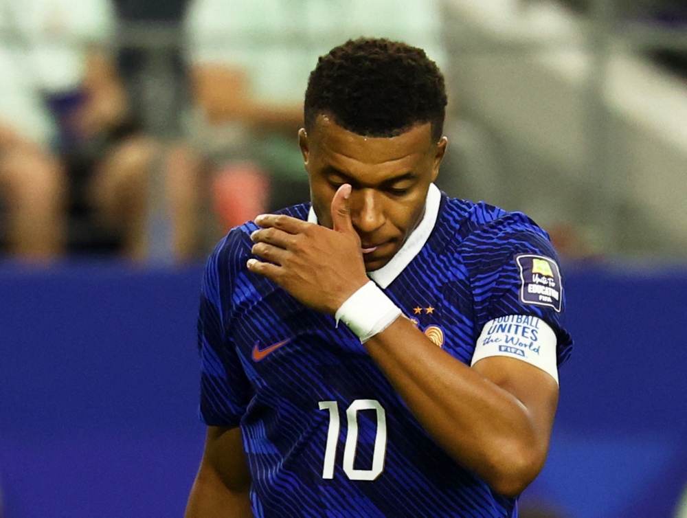 
France's Kylian Mbappe looks dejected during the match  