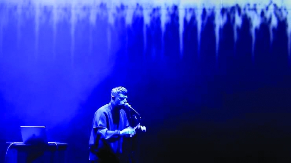 British artist Harry Yeff rehearses a song which uses artificial intelligence to render the human voice— AFP