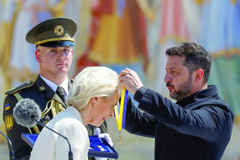 Ukraine's President Volodymyr Zelensky awards European Commission President Ursula von der Leyen with The Order of Europe in Kyiv. — Reuters