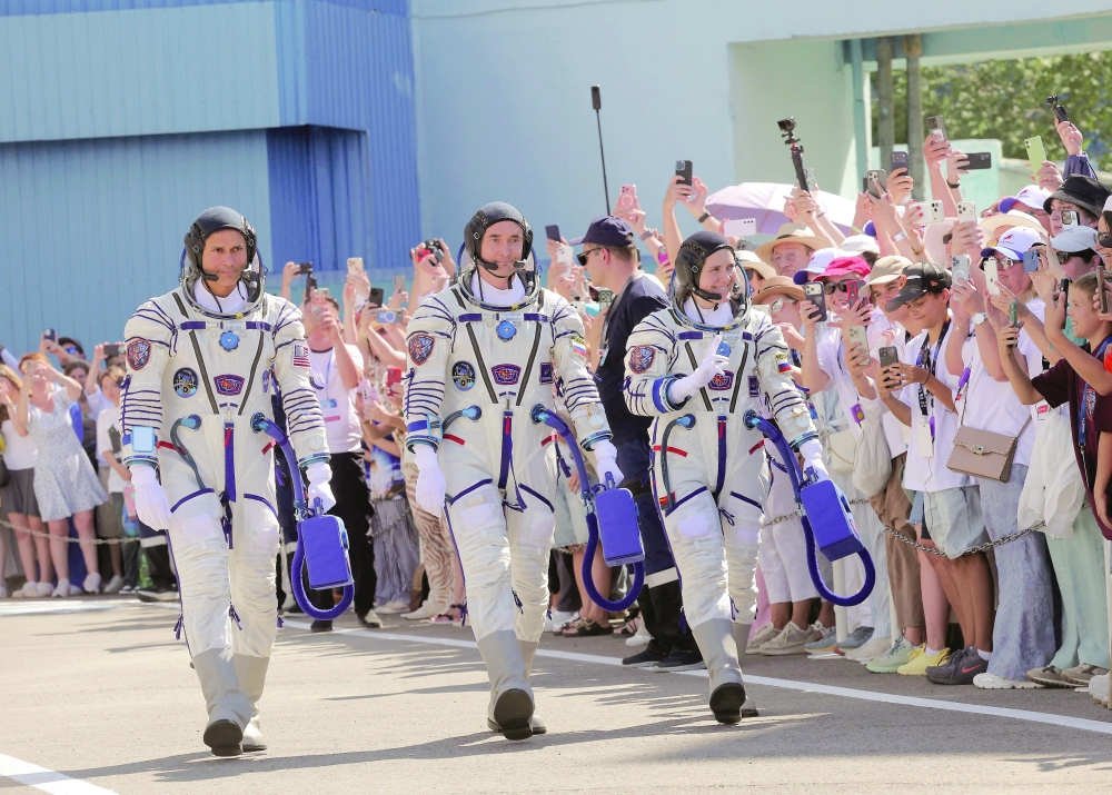 Crew members attend a send-off ceremony before the launch at the Baikonur cosmodrome in Baikonur, Kazakhstan. — Reuters