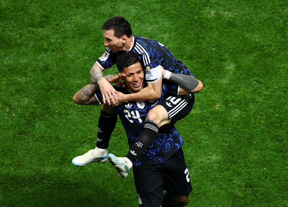  
Argentina's Fernandez celebrates scoring first goal Messi. — Reuters 