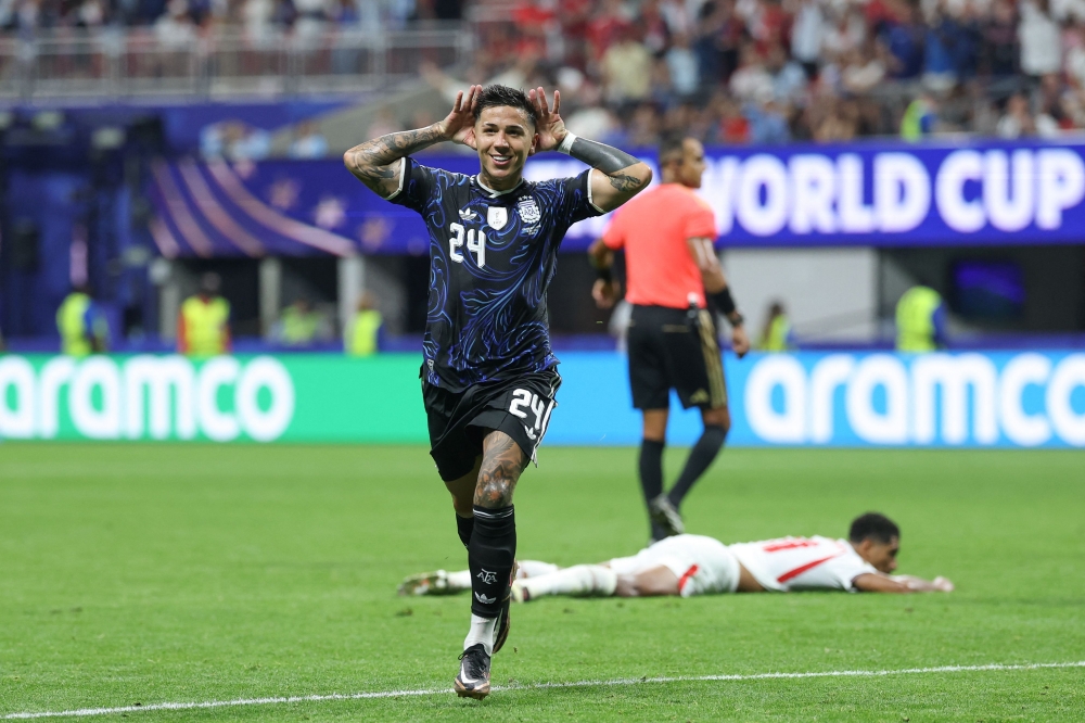 Argentina's #24 Fernandez celebrates first goal. — AFP
