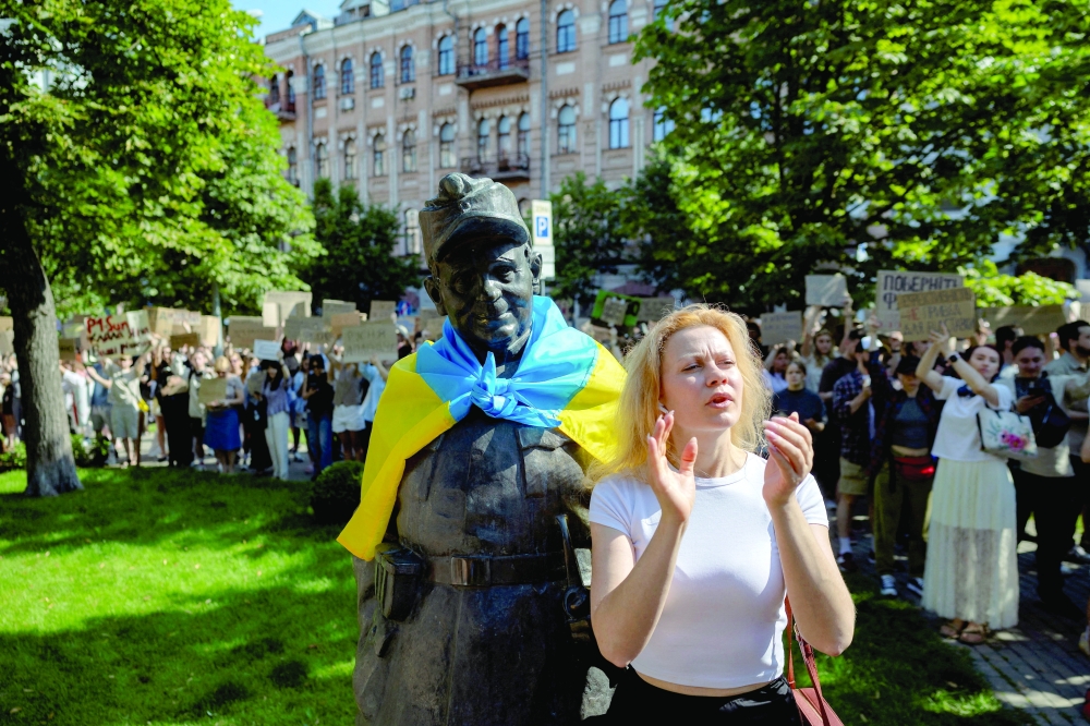 People protest against Ukrainian President Volodymyr Zelensky's decision to replace Mykhailo Fedorov as defence minister in Kyiv on Thursday. — Reuters