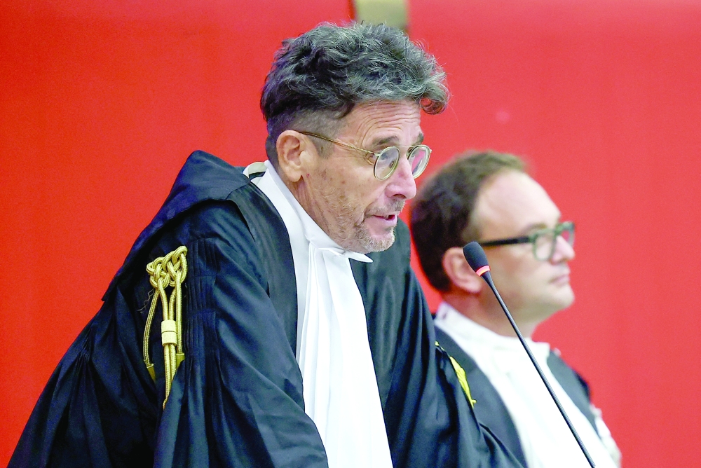 Judge Paolo Lepri reads a verdict in the trial over the 2018 deadly collapse of the Morandi motorway bridge, in Genoa on Thursday. — Reuters