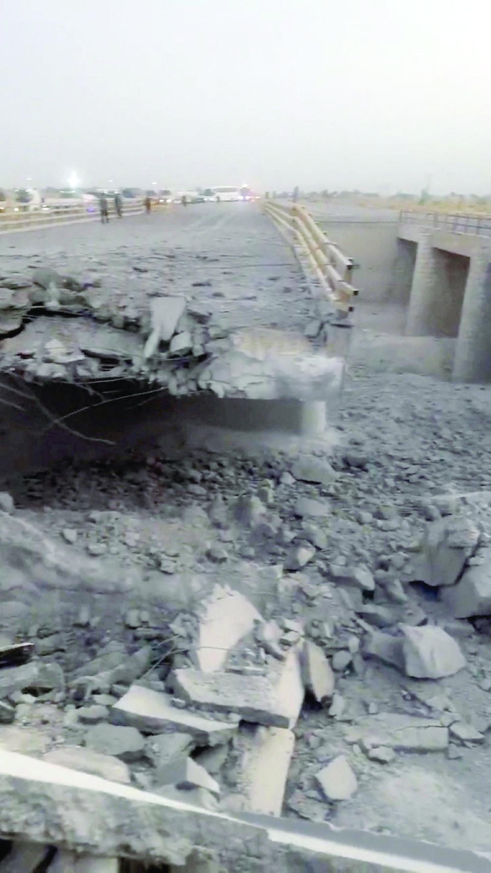 A damaged portion of a bridge in the aftermath of a US strike, in Bandar Khamir, Hormozgan province, Iran, on Friday in this screen grab from social media. — Reuters