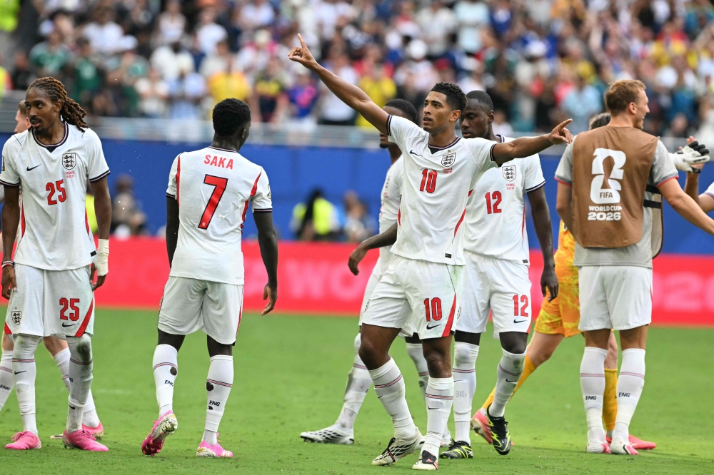 England's midfielder #10 Jude Bellingham celebrates  