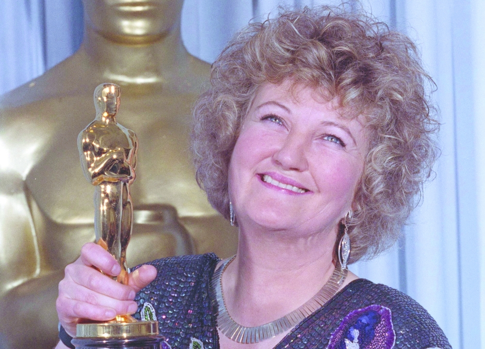 Brenda Fricker holds up her Oscar after winning the Best Supporting Actress category at Academy Awards. -Reuters