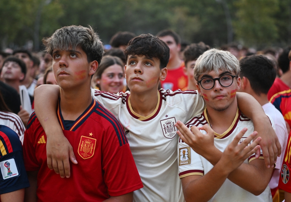  
Spain fans watch the FIFA World Cup final. — Reuters  