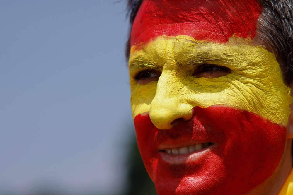 A fan of Spain wears face paint. — AFP