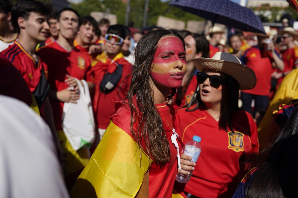  
Spain fans gather at the fan zone in the Plaza de Colon. — Reuters   