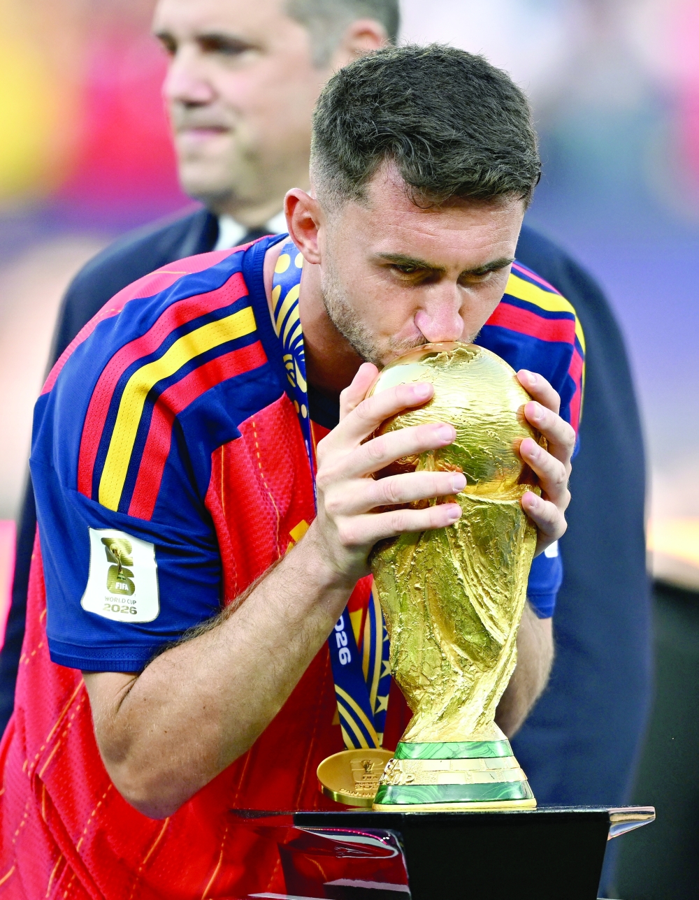  
Spain's Aymeric Laporte kisses the World Cup trophy. — Reuters