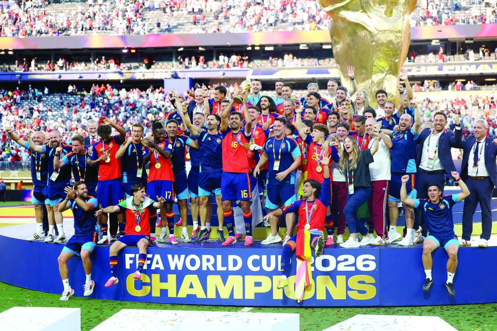  
Spain's Rodri lifts the World Cup trophy alongside teammates. — Reuters