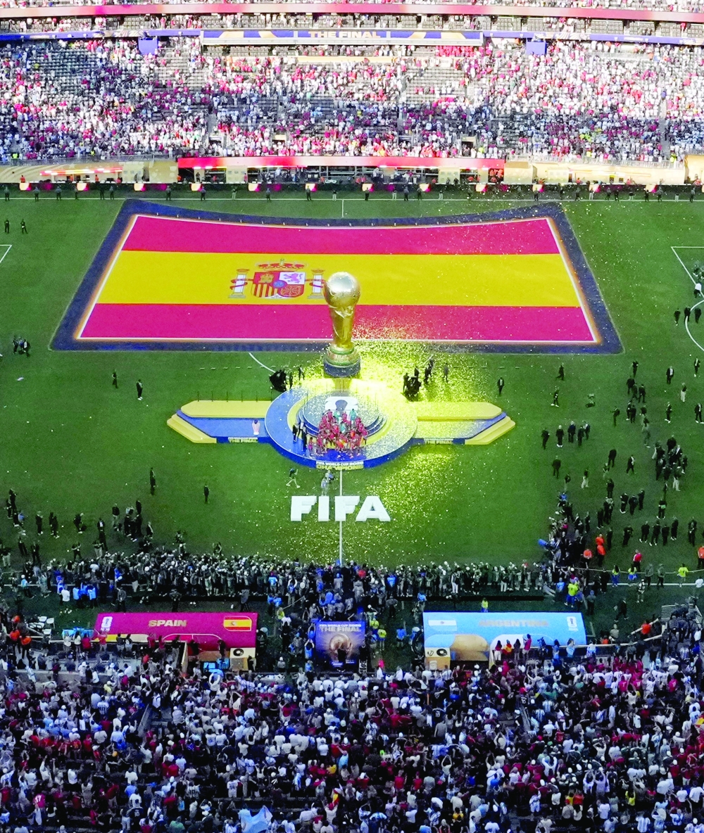  
General view as Spain's Rodri lifts the World Cup trophy alongside teammates. — Reuters