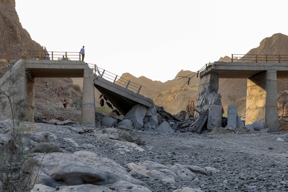  A heavily-damaged bridge which was hit by a US strike is pictured along the road connecting Roudan and Bandar Abbas in southern Iran