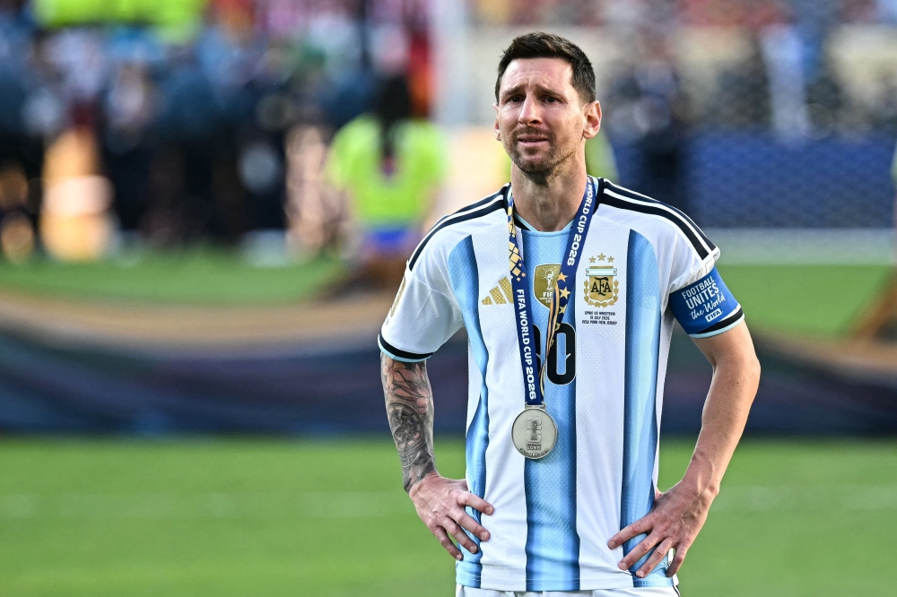  Argentina's forward #10 Lionel Messi cries during the trophy ceremony at the end of the 2026 World Cup football tournament final  
