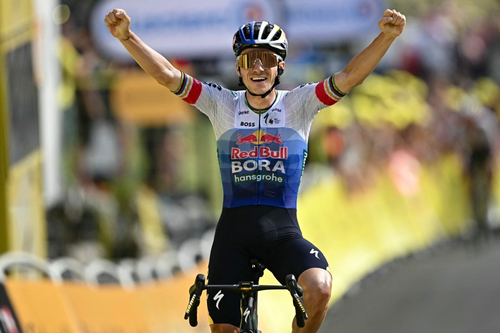 Hansgrohe team's Belgian rider Remco Evenepoel cycles to the finish line to win the 15th stage of the 113th edition of the Tour de France cycling race 