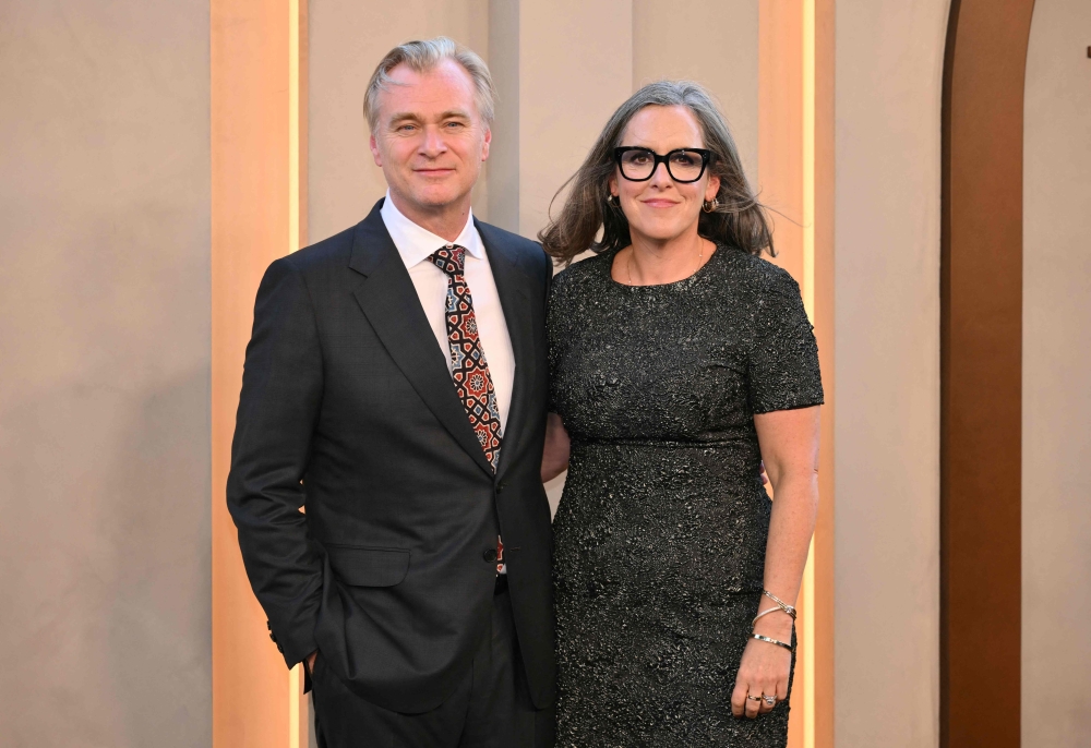 British director Christopher Nolan and his wife British producer Emma Thomas — AFP