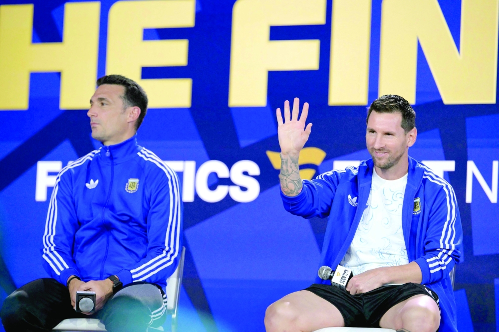 Argentina's forward #10 Lionel Messi (R). — AFP