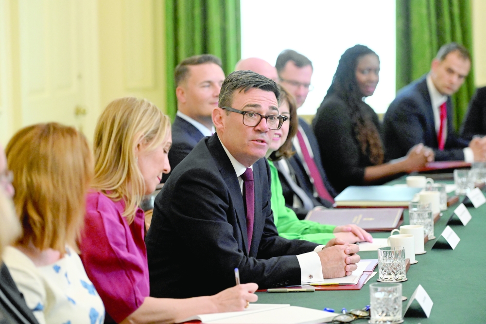 British Prime Minister Andy Burnham holds his first Cabinet meeting, in London. — Reuters 