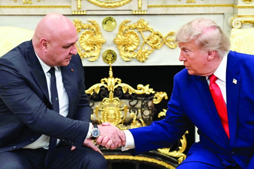 US President Donald Trump shakes hands with Lebanese President Joseph Aoun in the Oval Office of the White House. — AFP