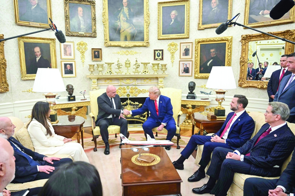 US President Donald Trump shakes hands with Lebanese President Joseph Aoun in the Oval Office of the White House. — AFP
