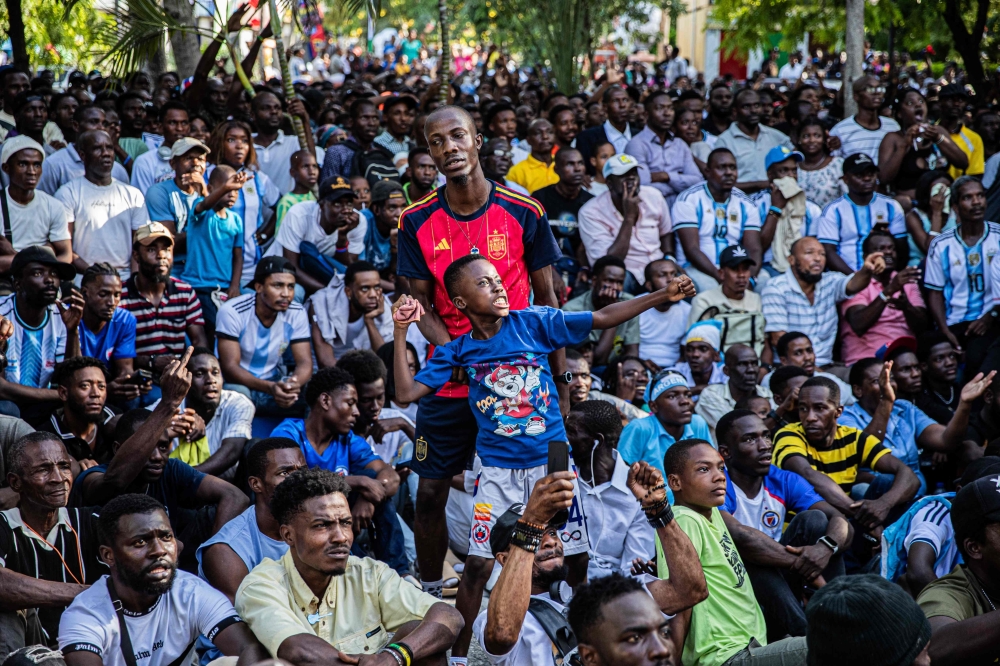 A young boy reacts as he watches the 2026 World Cup Final between Spain and Argentina in Port-au-Prince 