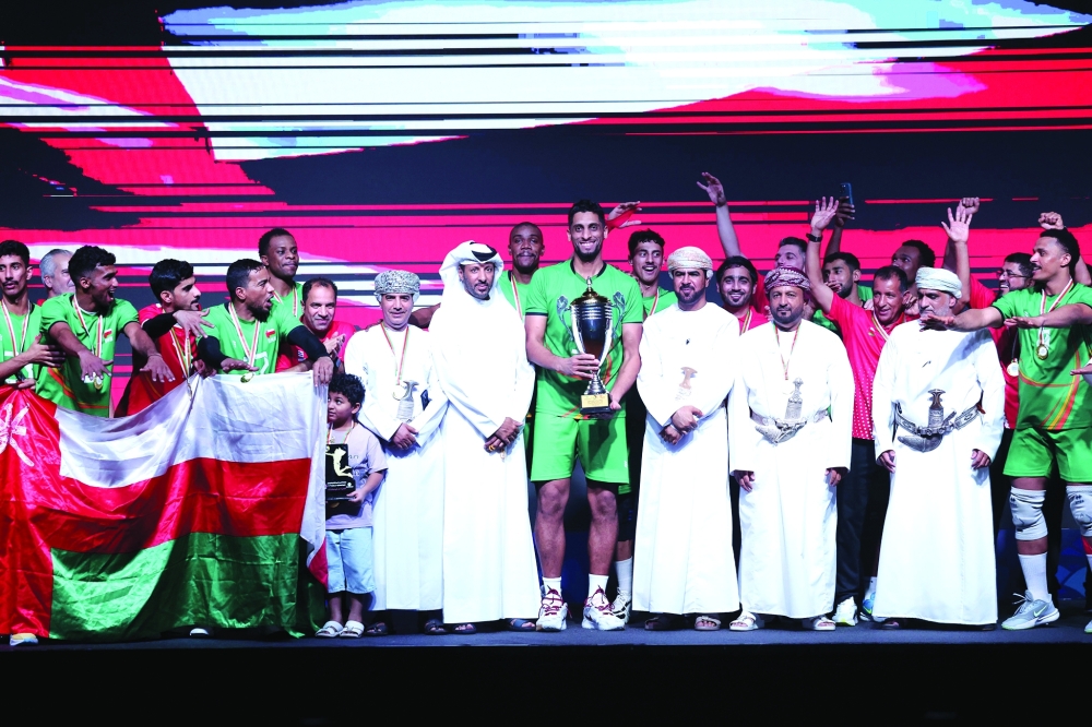 Oman team celebrate with the trophy after the winning in Muscat. — Abdulwahid al Hamadani