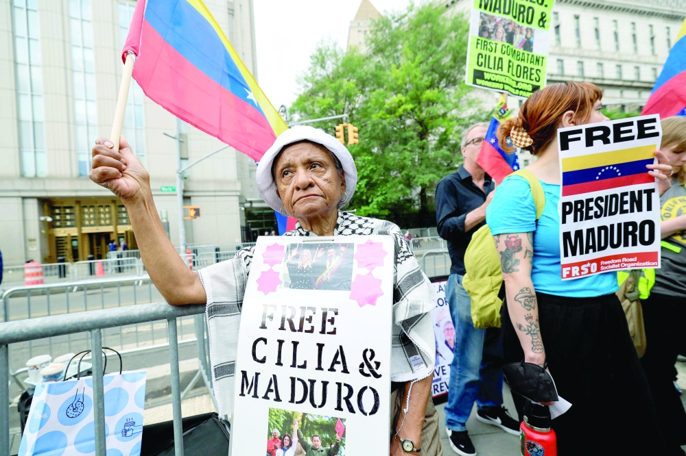 
Demonstrators hold signs in support of ousted Venezuelan president Nicholas Maduro outside the courthouse in New York City. — AFP 