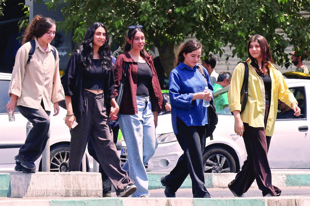 
Pedestrians cross a busy road at the Islamic Revolution Square in Tehran on Wednesday. - AFP 